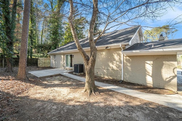 back of property featuring a patio and central air condition unit