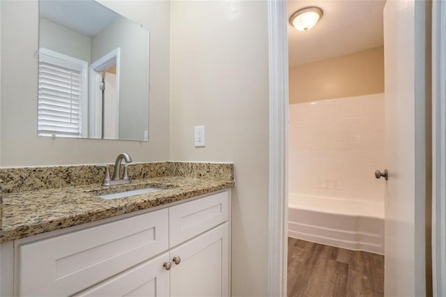 bathroom featuring wood-type flooring and vanity