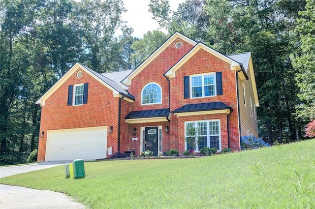 view of front of house featuring an attached garage, concrete driveway, a front lawn, a standing seam roof, and view of scattered trees