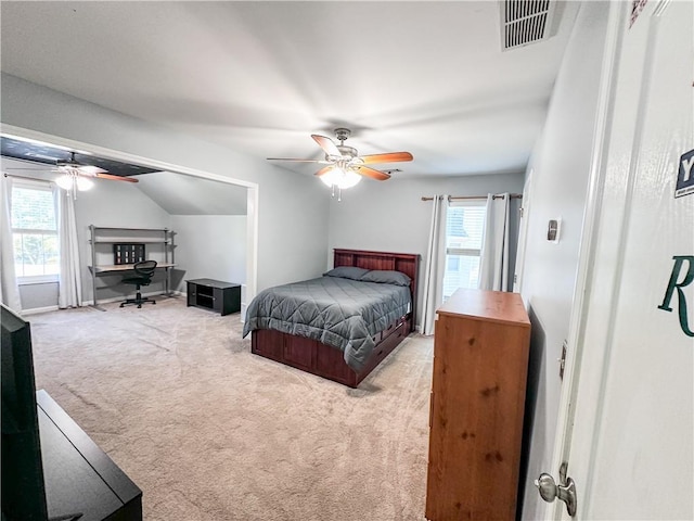 bedroom with light carpet, multiple windows, a ceiling fan, and lofted ceiling