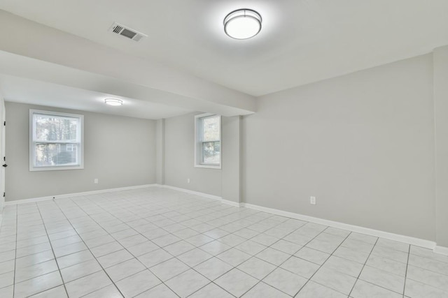 spare room featuring light tile patterned flooring