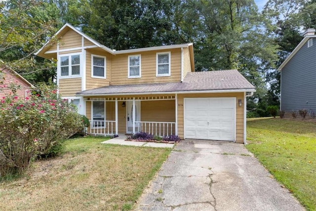 view of front of property featuring a garage, a porch, and a front lawn