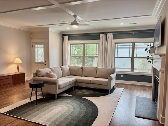 living area with ceiling fan, ornamental molding, wood finished floors, recessed lighting, and baseboards