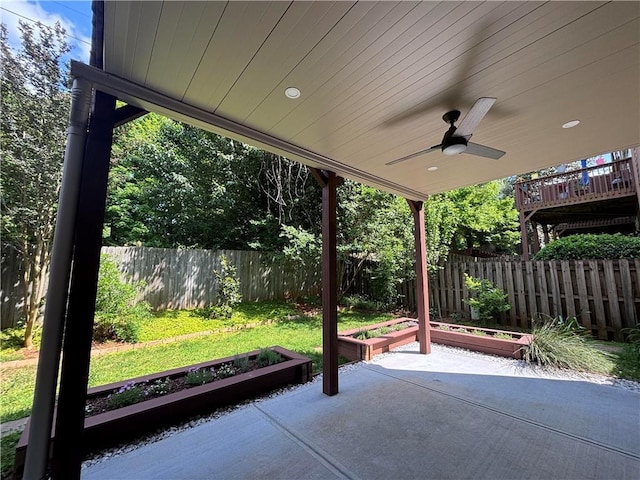 view of patio / terrace with a ceiling fan and a vegetable garden