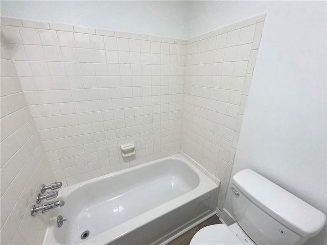 full bathroom featuring bathtub / shower combination and toilet