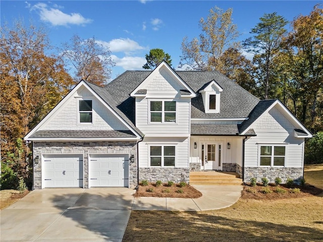 view of front of house featuring covered porch and a garage