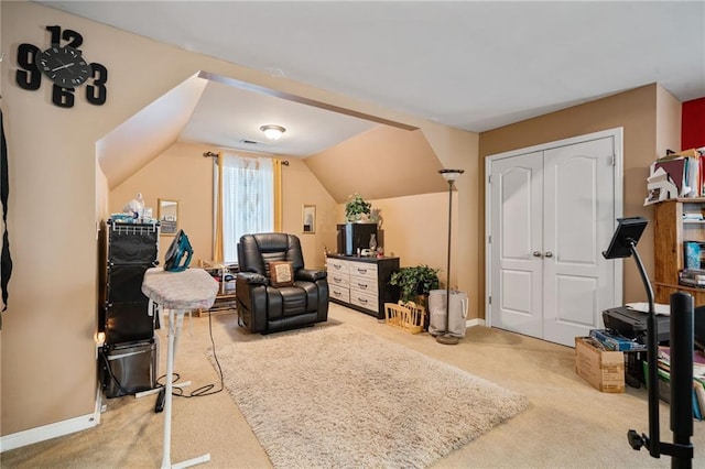 living area featuring lofted ceiling and carpet floors