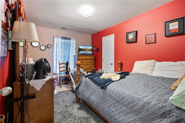 bedroom featuring visible vents and carpet floors