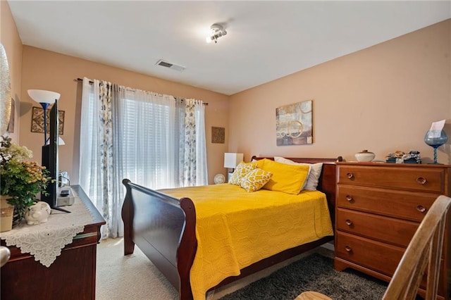 bedroom with visible vents and carpet floors