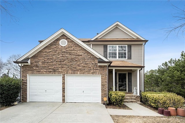 view of front of home with stone siding, concrete driveway, and an attached garage