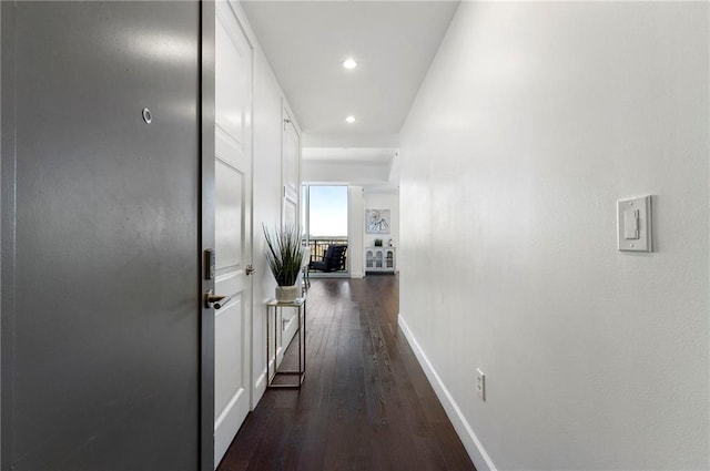 hallway featuring dark hardwood / wood-style flooring