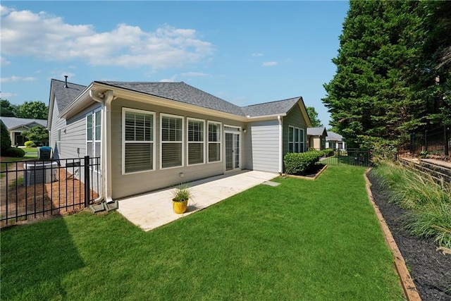507 Bonneset Ct, Canton, GA 30114 - rear view of house featuring a fenced backyard, a patio, and a shingled roof