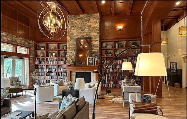 507 Bonneset Ct, Canton, GA 30114 - living room with a wooden ceiling with exposed beams, a chandelier, wood finished floors, a high ceiling, and wood walls