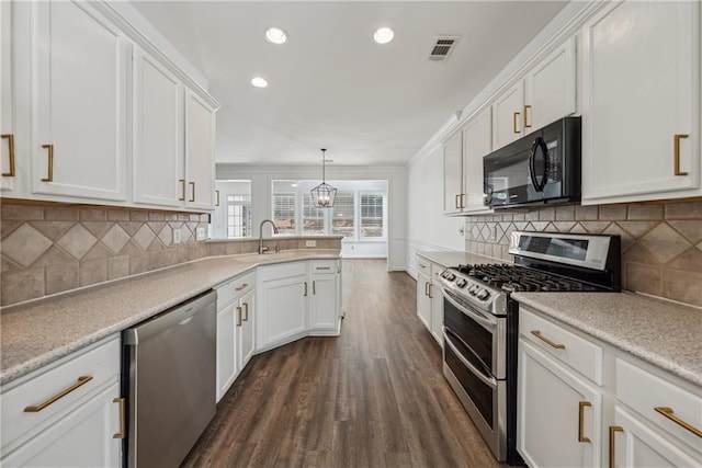 507 Bonneset Ct, Canton, GA 30114 - kitchen with appliances with stainless steel finishes, dark wood finished floors, white cabinets, light countertops, and recessed lighting