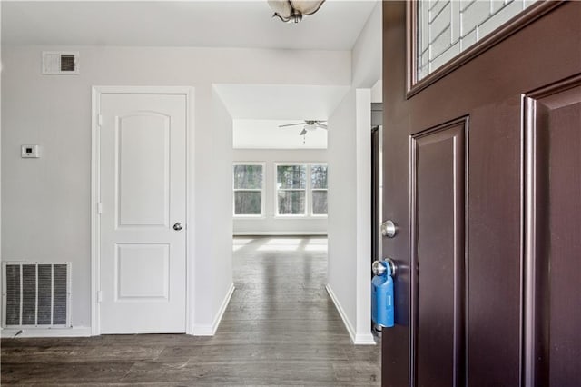 foyer entrance with dark hardwood / wood-style floors and ceiling fan