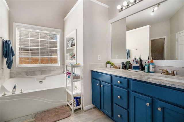 bathroom featuring double vanity, a garden tub, and a sink