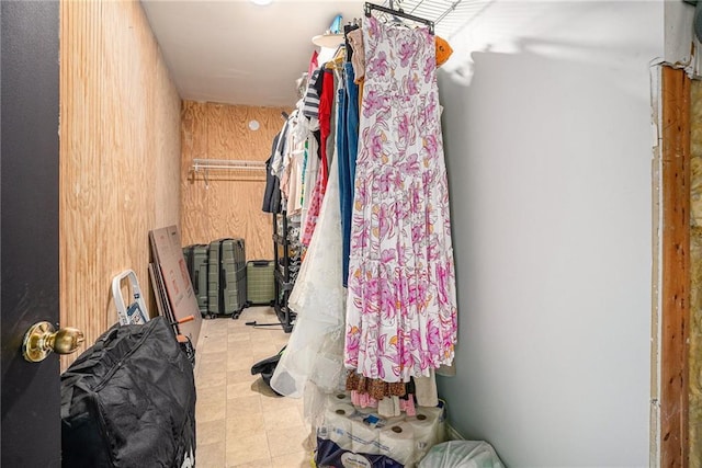 walk in closet with tile patterned floors