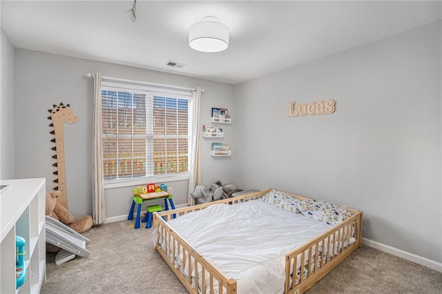 bedroom with visible vents, baseboards, and carpet floors