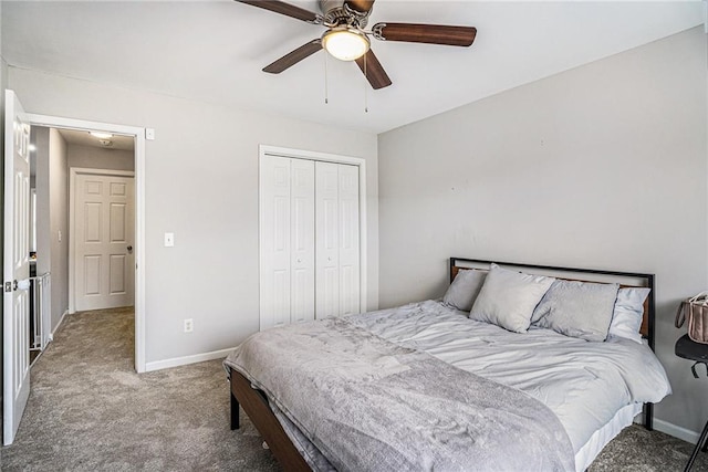 carpeted bedroom featuring a closet, a ceiling fan, and baseboards