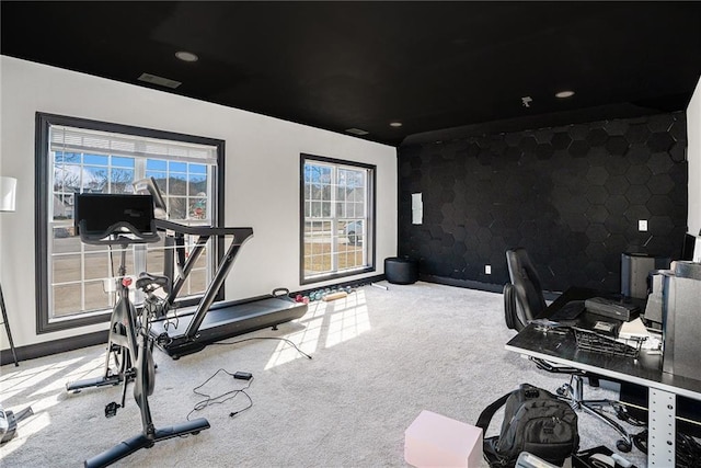 workout room with visible vents, baseboards, and carpet