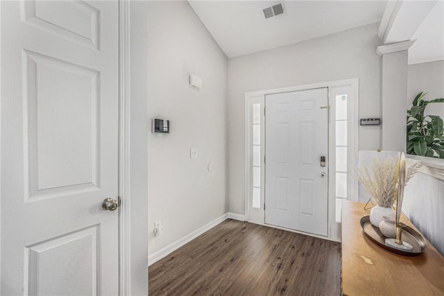 entrance foyer featuring a wealth of natural light, visible vents, baseboards, and dark wood-style flooring