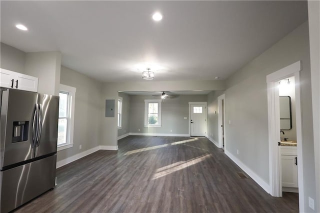 interior space featuring ceiling fan, recessed lighting, dark wood-type flooring, visible vents, and baseboards