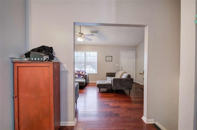 corridor featuring dark hardwood / wood-style flooring