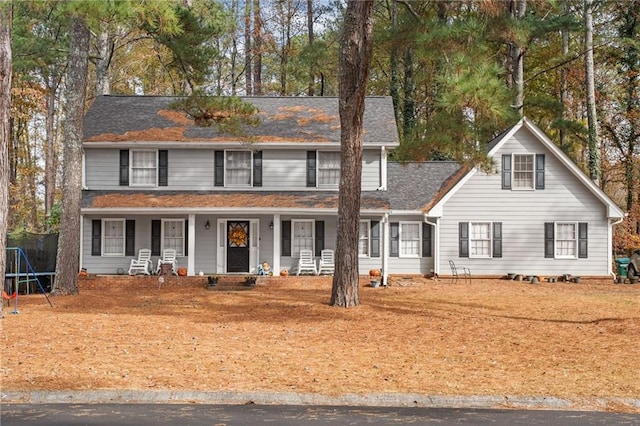 view of front of home featuring a porch and a trampoline