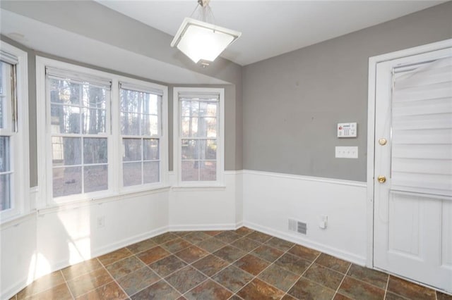 unfurnished dining area featuring a healthy amount of sunlight