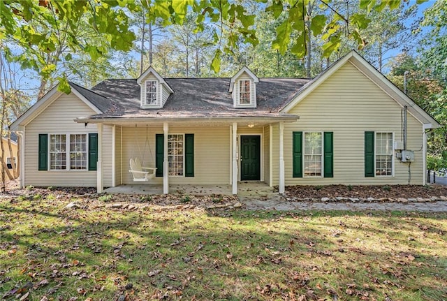 new england style home with a front yard