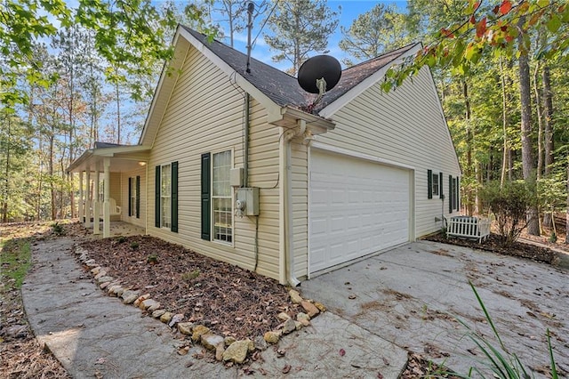 view of side of home with a garage