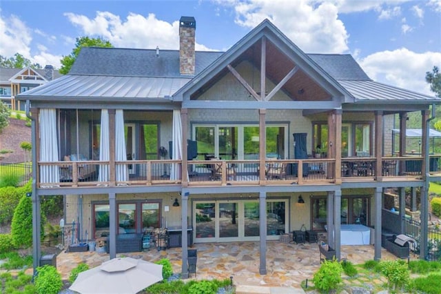 back of property featuring outdoor lounge area and a patio