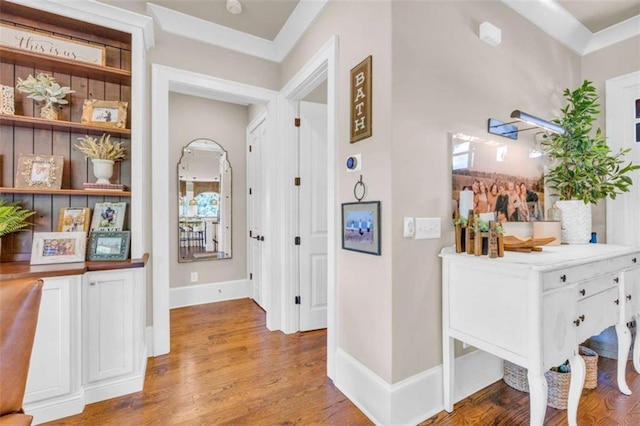 hallway featuring crown molding and wood-type flooring