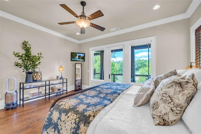 bedroom featuring hardwood / wood-style flooring, ceiling fan, access to exterior, and ornamental molding