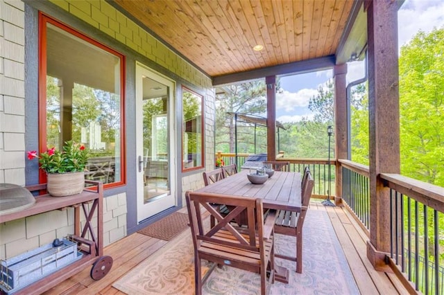 sunroom featuring wood ceiling