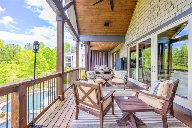 deck featuring ceiling fan and an outdoor hangout area