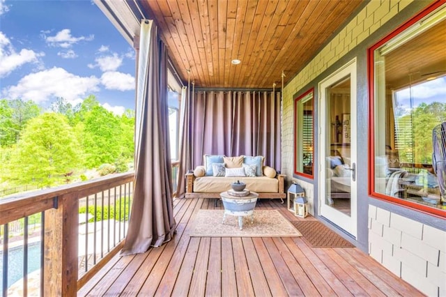 unfurnished sunroom featuring wood ceiling