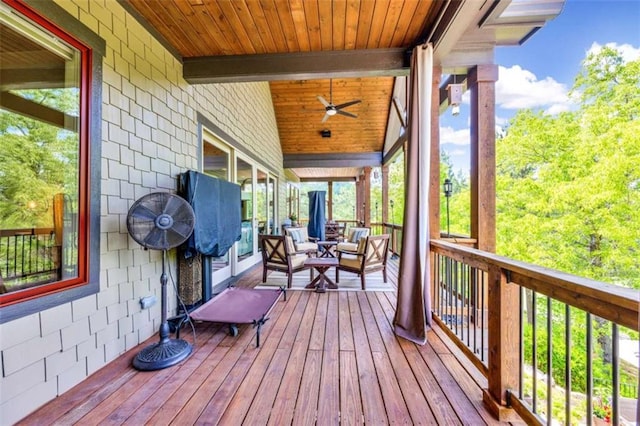 deck featuring ceiling fan and an outdoor hangout area