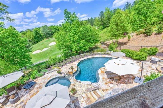 view of swimming pool featuring a patio area