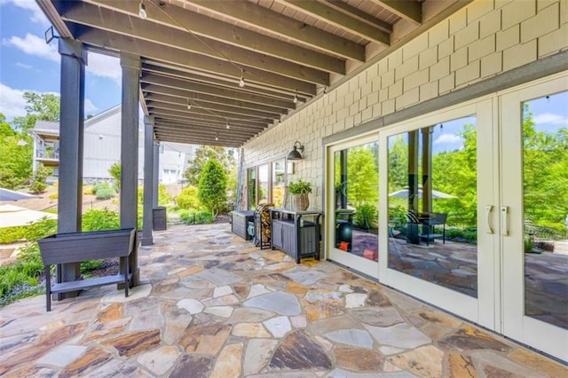 view of patio featuring french doors