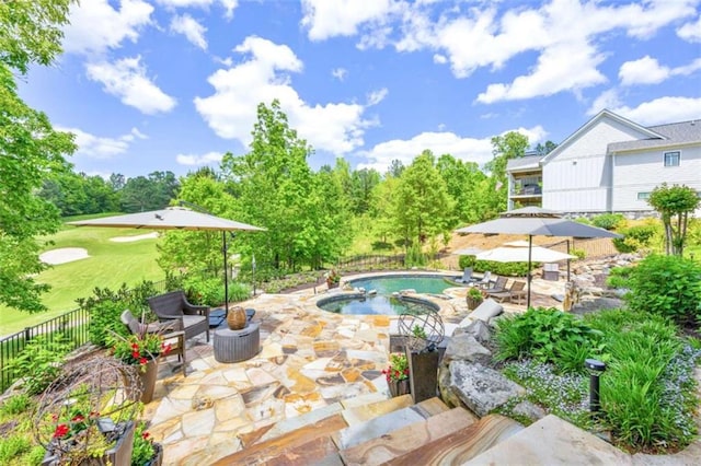 view of pool with a patio area and an in ground hot tub