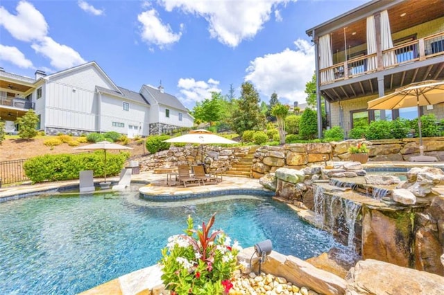 view of swimming pool with a patio