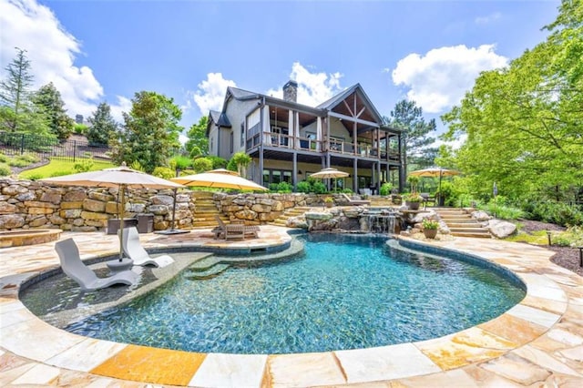 view of pool featuring pool water feature