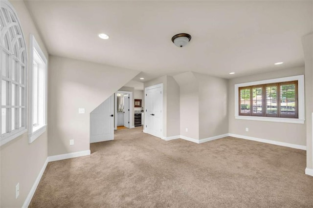 carpeted empty room featuring a healthy amount of sunlight