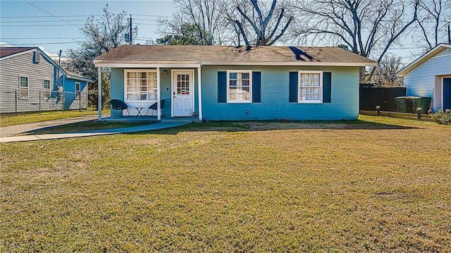 view of front of property with a front yard and covered porch