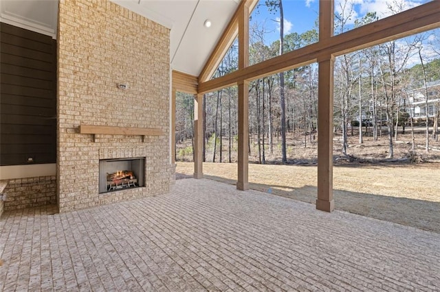 view of patio / terrace with an outdoor brick fireplace