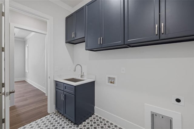 clothes washing area featuring cabinet space, tile patterned floors, a sink, hookup for a washing machine, and electric dryer hookup