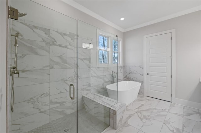 bathroom with marble finish floor, crown molding, tile walls, a stall shower, and a freestanding tub