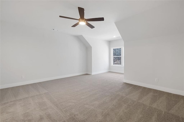 bonus room featuring carpet, baseboards, and ceiling fan