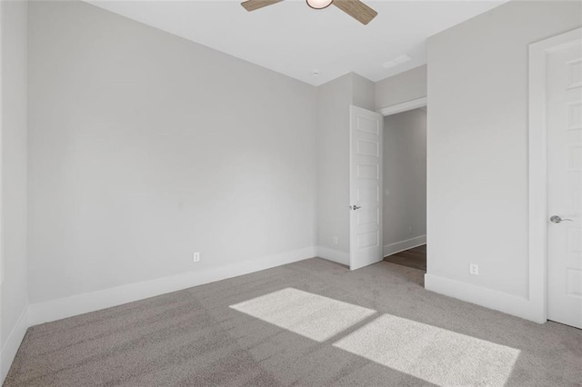 unfurnished bedroom featuring carpet floors, ceiling fan, and baseboards